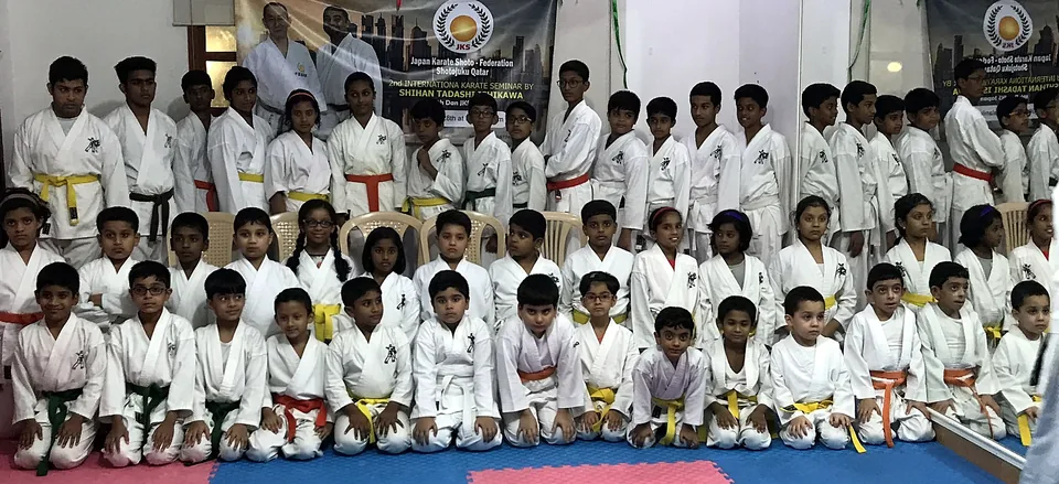 Large group of Chi Club karate students at the dojo in Doha